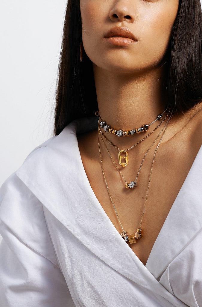 full view of model wearing 4 build it necklaces  Bagatiba