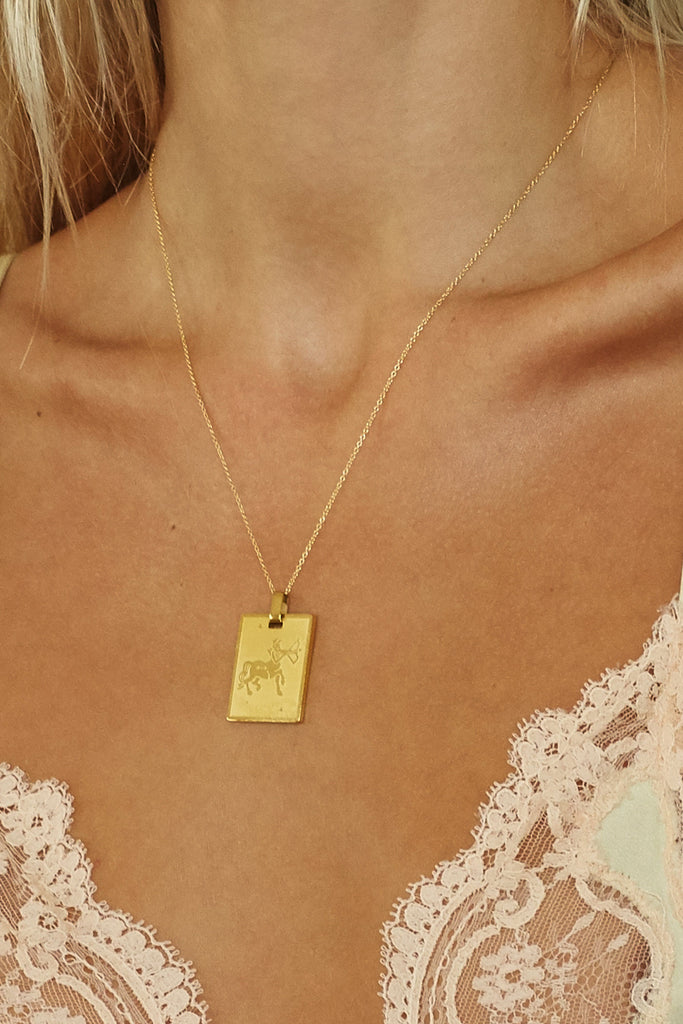 Close view of Sagittarius Charm on model by Bagatiba