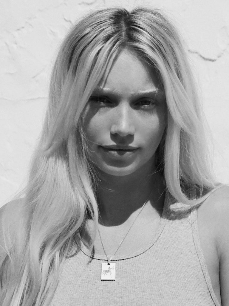 black and white portrait of a Sagittarius woman in the sagittarius Charm by Bagatiba