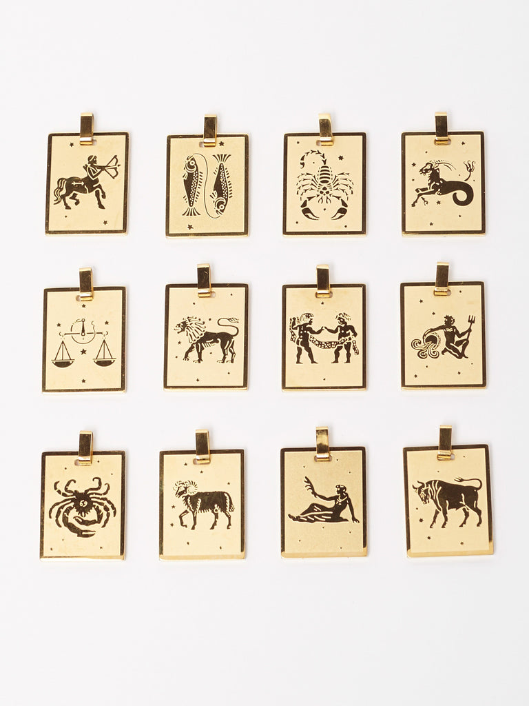 Full view flat lay of Zodiac charm collection including the Sagittarius Charm charm Bagatiba