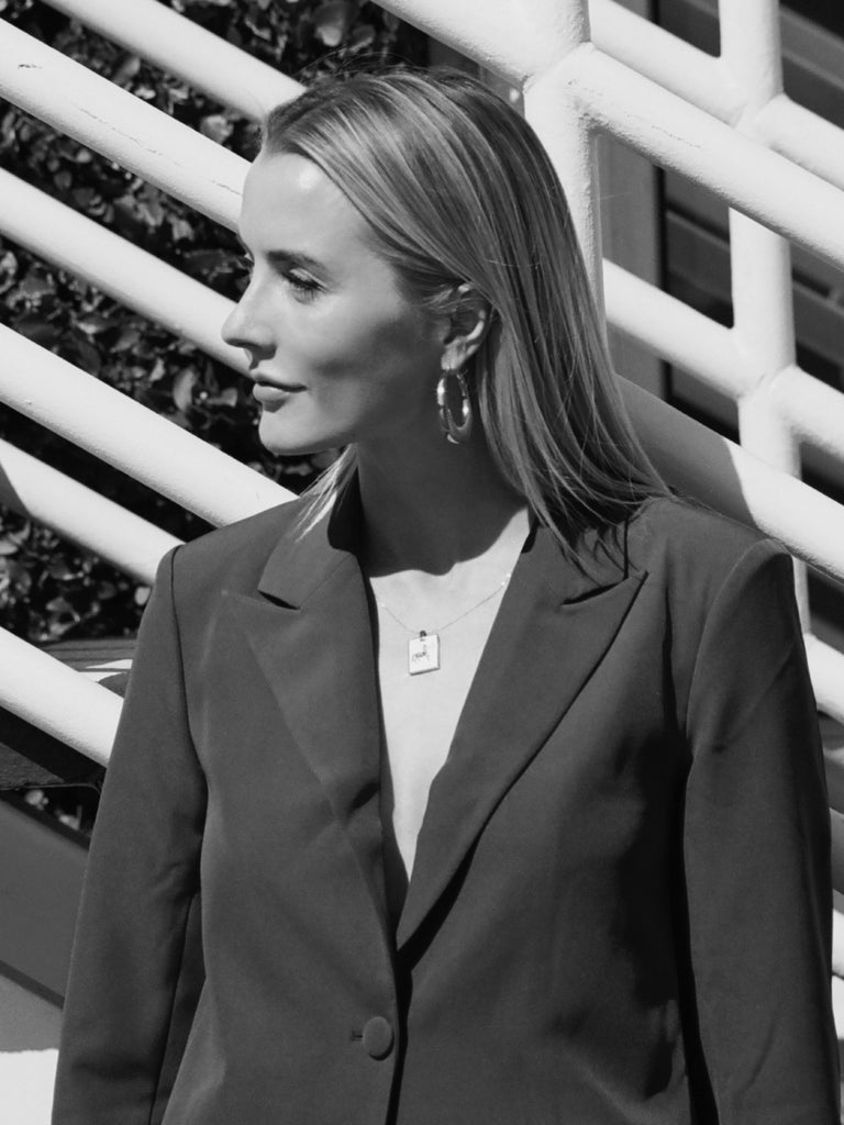 black and white portrait of a Sagittarius woman in the sagittarius Charm by Bagatiba