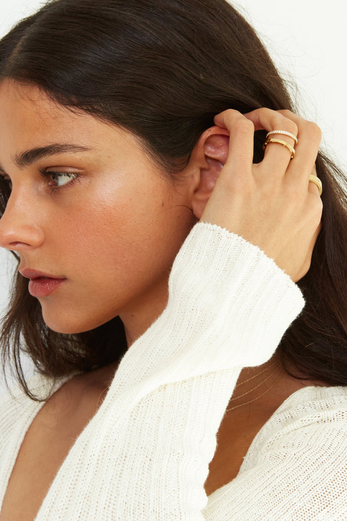 Side profile view on model Set of Gold Eco Huggies Earrings by Bagatiba
