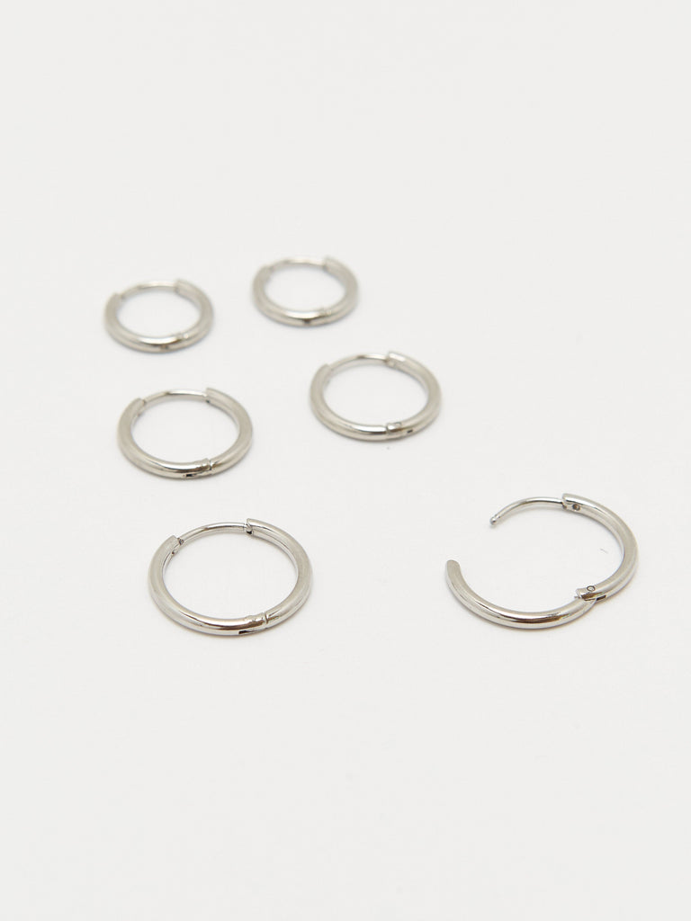 Detail view flat lay with open hoop of Set of Silver Eco Huggie Hoops Earrings Bagatiba