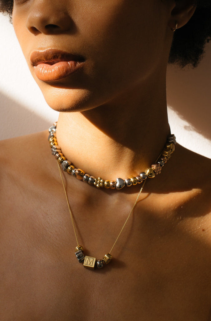 Model wearing the Silver Bead Set on choker chain paired with multibead set by Bagatiba