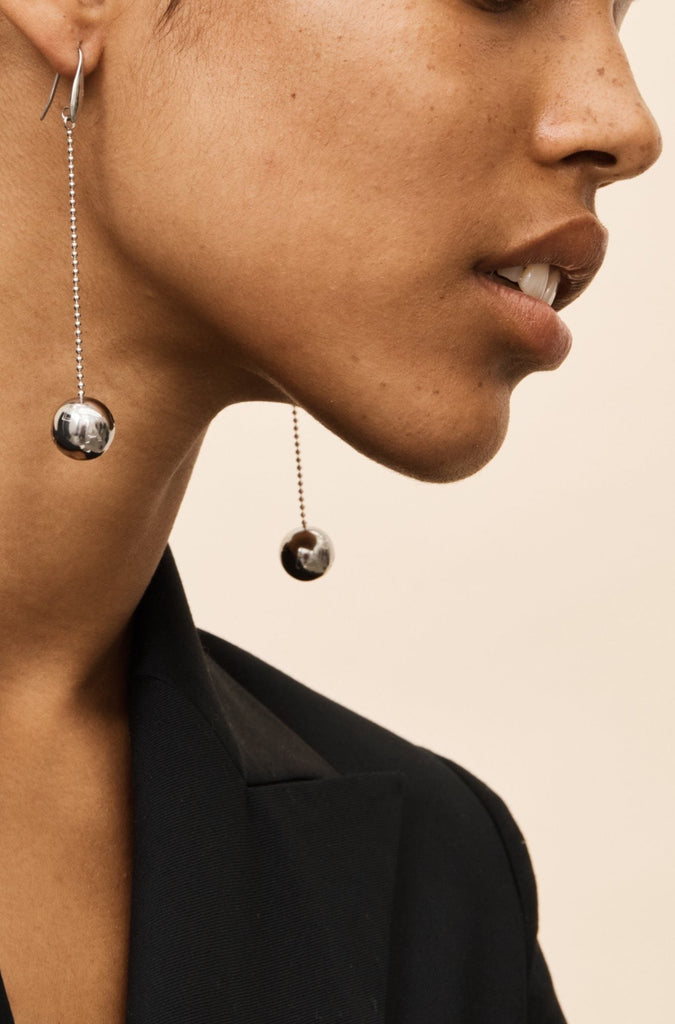 Silver Drop Sphere Earrings worn by model  bagatiba