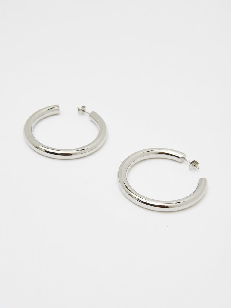 Detailed flat lay view of Silver Hollow Hoops Earrings Bagatiba