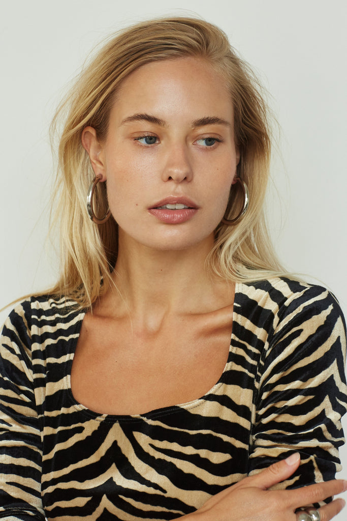 Full view of model in Silver Hollow Hoops Earrings Bagatiba