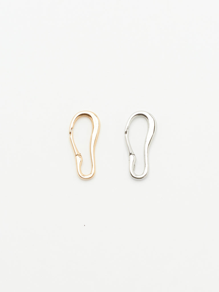 Full view flat lay of Gold and Silver Molded Clips Body Bagatiba