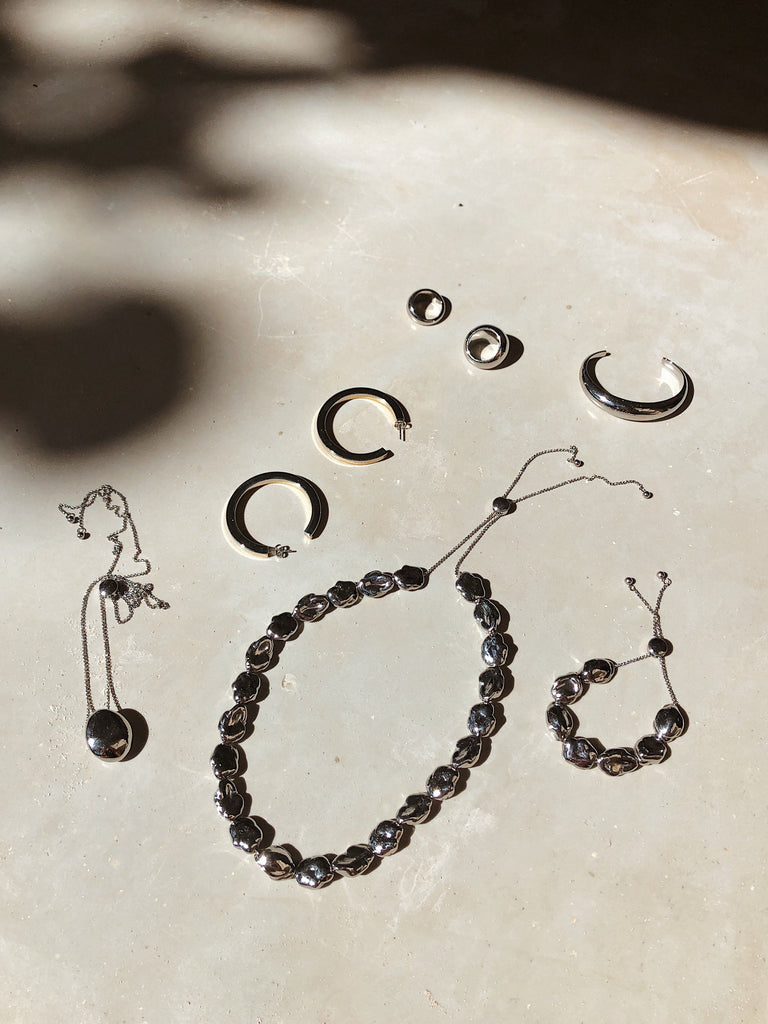 Silver Pearl Bracelet shown in natural light with other styles by bagatiba