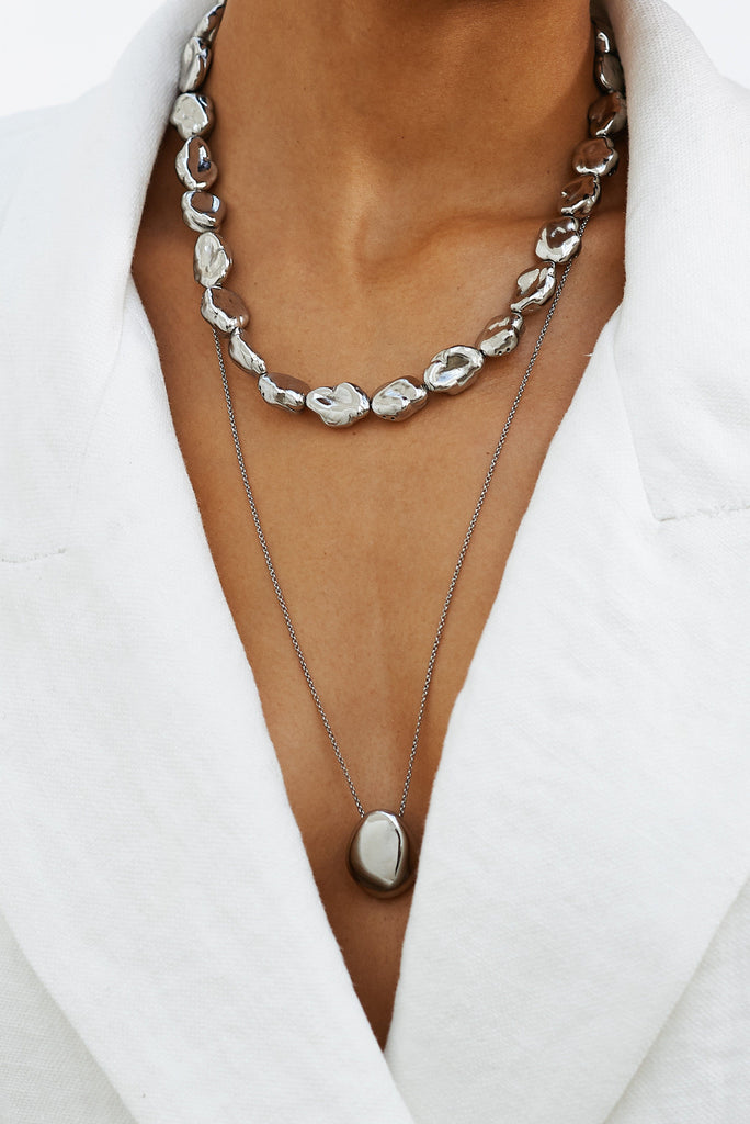 Detailed view on model of Silver Pearl Necklace and Silver Orb Necklace by bagatiba