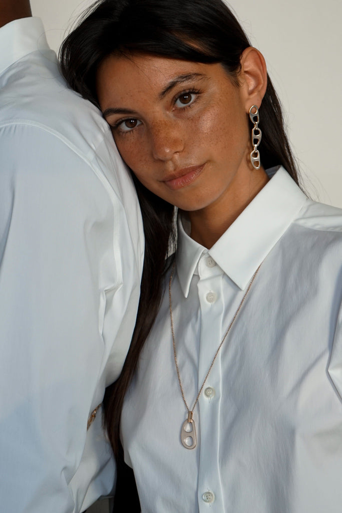 Model wearing the Silver Tab Drop Earrings and Silver Tab Adjustable Necklace by bagatiba