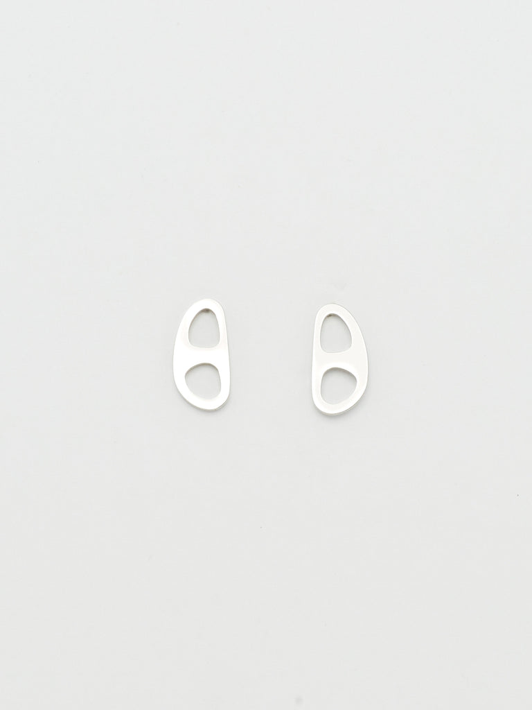 Overhead flat lay view of the Silver Tab Studs Earrings bagatiba