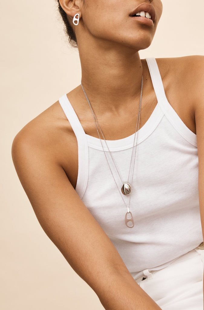 Model wearing the Silver Tab Studs Earrings bagatiba