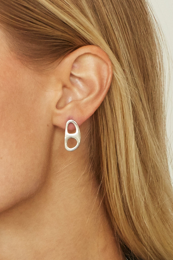 Detail view on ear of Silver Tab Studs Earrings bagatiba