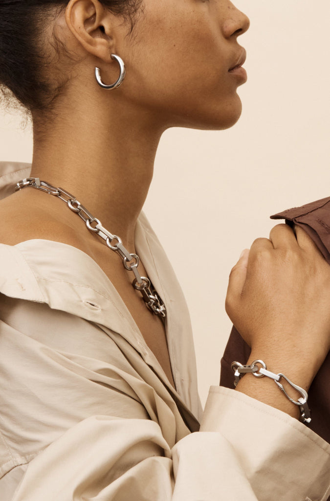 Side profile view of model in Silver Tilda Bracelet and Necklace by bagatiba