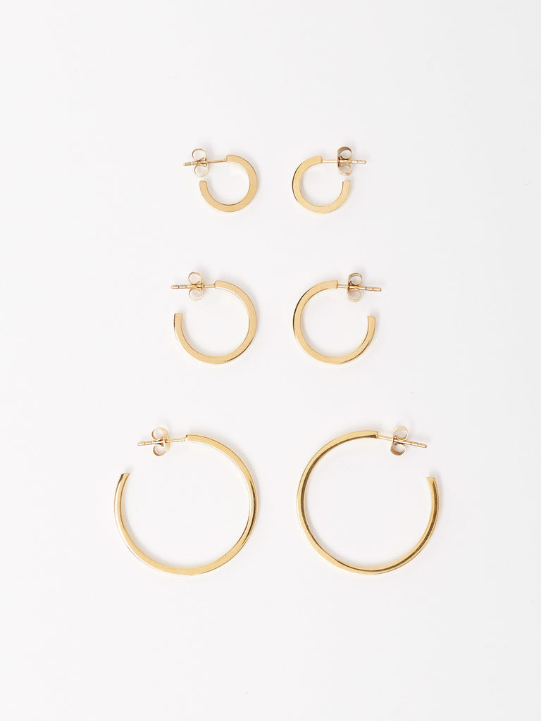 Full view flat lay of the Simple Gold Hoops, Small Simple Gold Hoops and Mini Simple Gold Hoops Earrings by Bagatiba