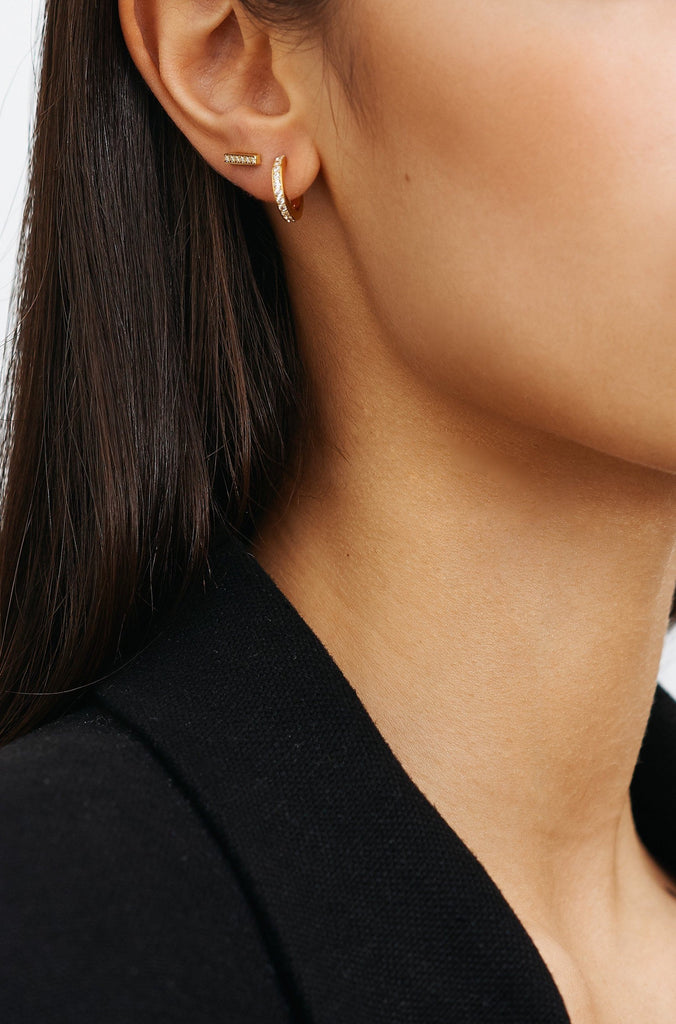 Model profile view of the Small Diamond Hoops Earrings Bagatiba