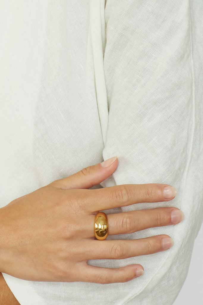Detail view on middle finger of Small Gold Orb Ring Ring bagatiba