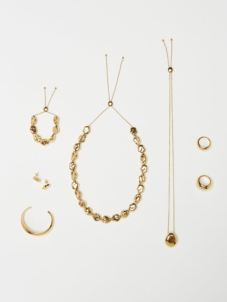 Full view flat lay of the Orb Collection including the Small Gold Orb Ring Ring bagatiba