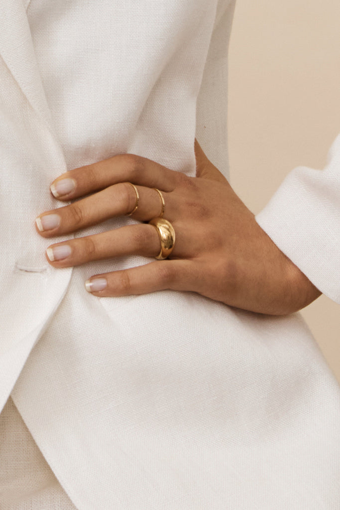 Detail view on model's hand of Small Gold Orb Ring Ring bagatiba