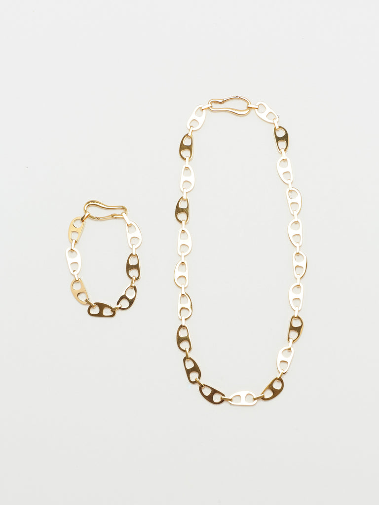 Full view flat lay of Small Gold Tab Necklace and Bracelet by bagatiba