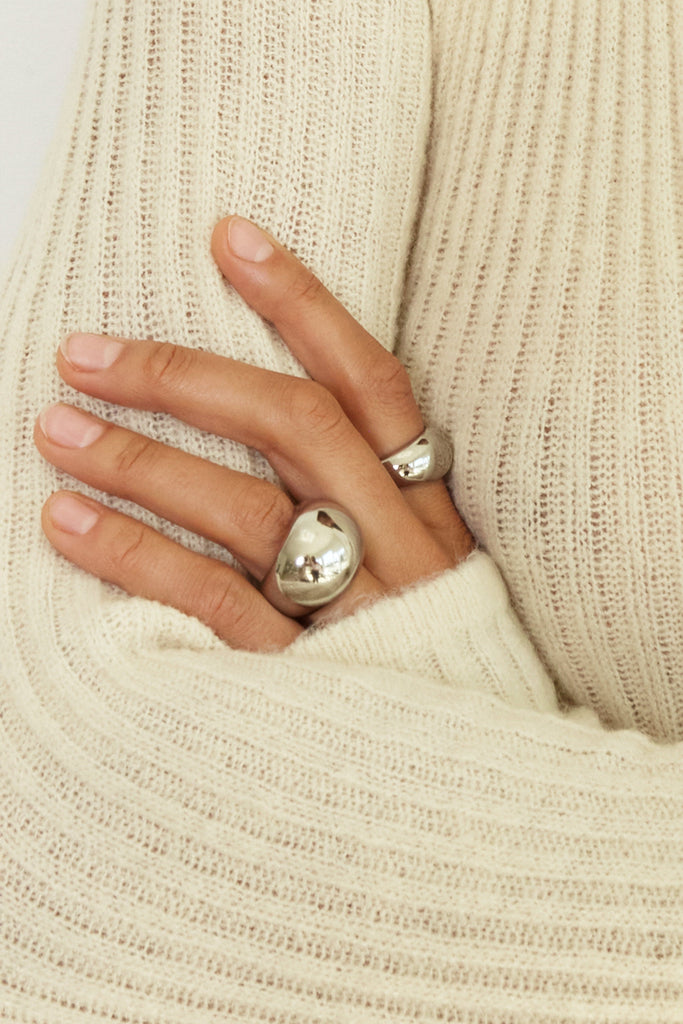cropped view on hand of Small Silver Orb Ring Ring bagatiba