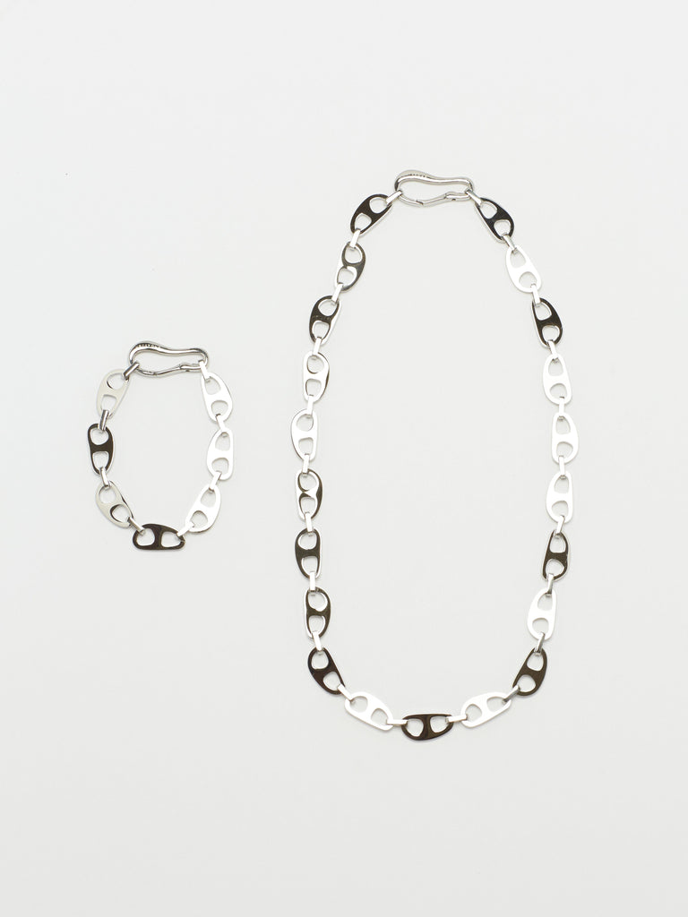 Full view flat lay of the Small Silver Tab Bracelet and Necklace bagatiba