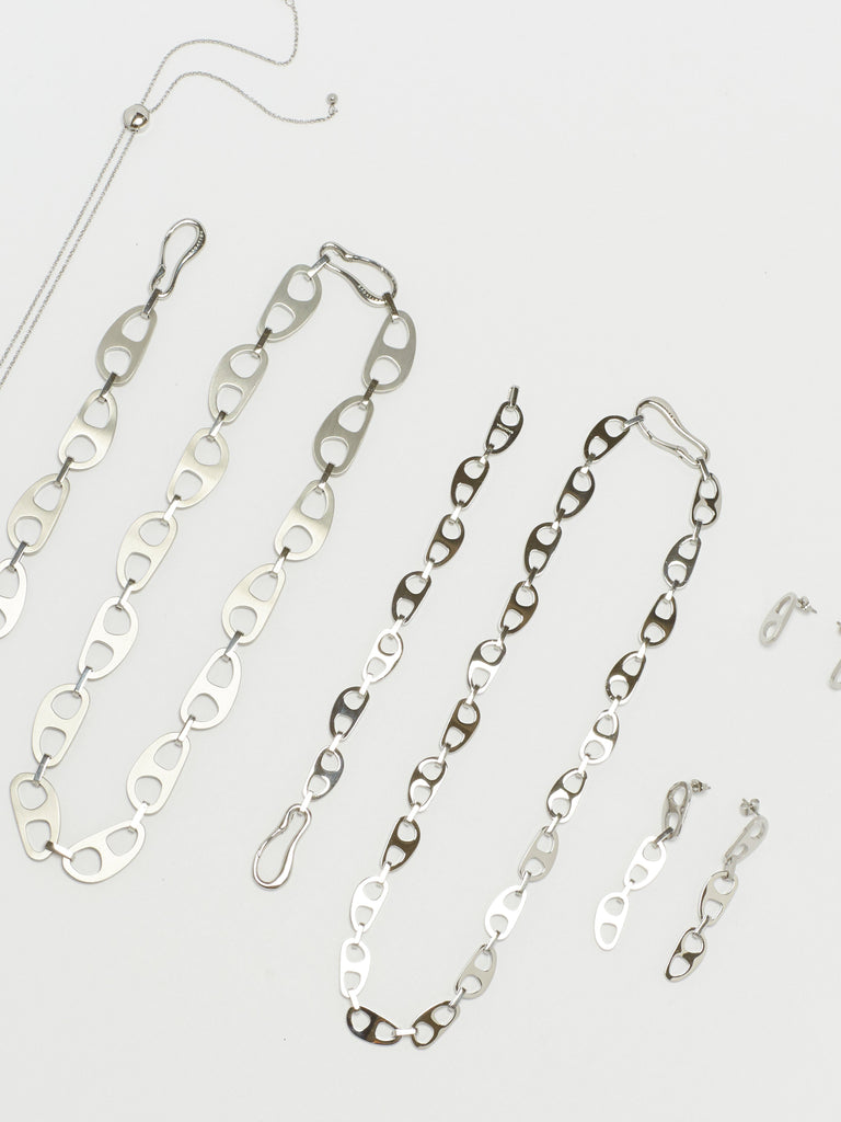 Cropped flat lay view of Small Silver Tab Necklace Necklace bagatiba