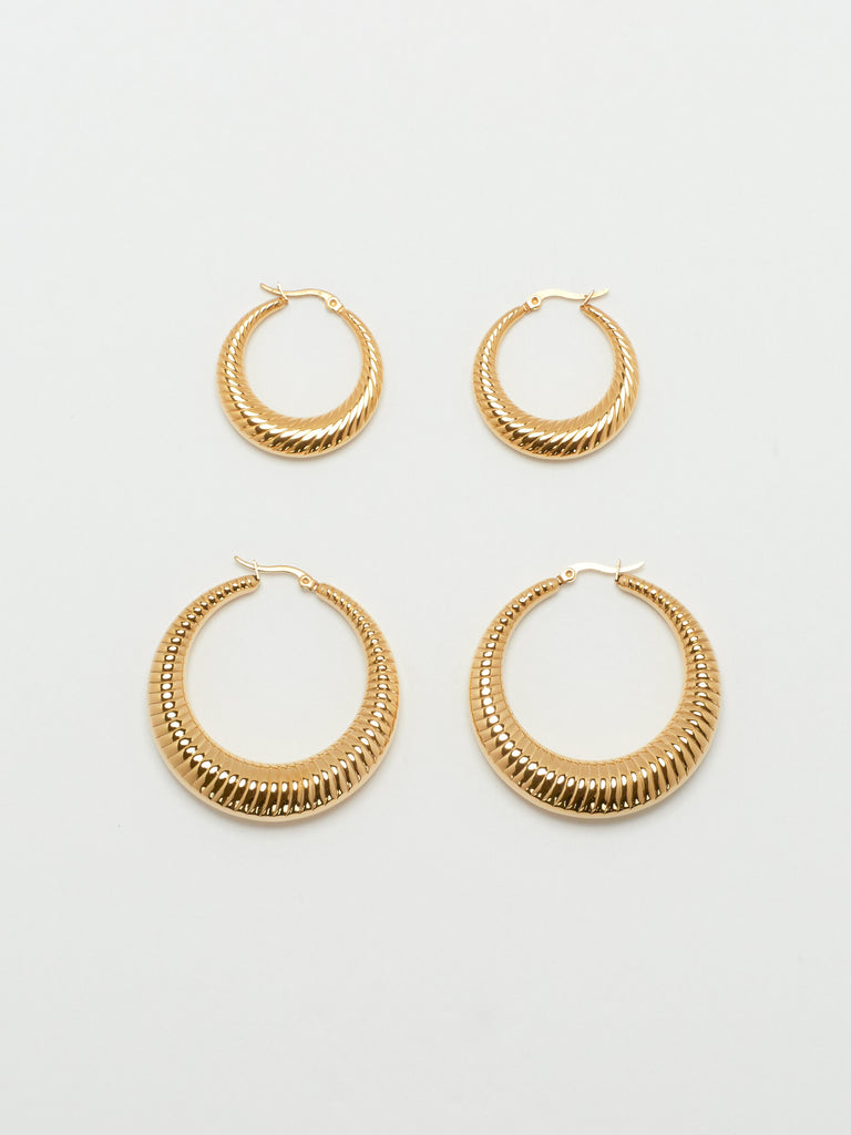 Full view flat lay of the Small Spiral Hoops and Spiral Hoops by bagatiba