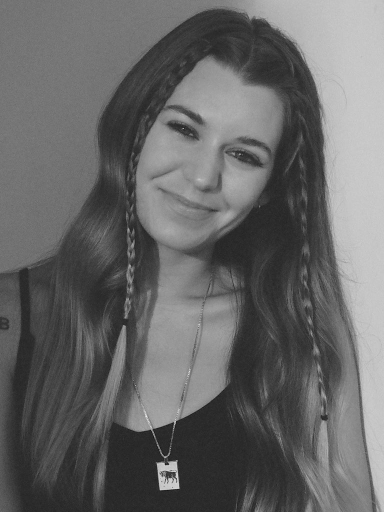 Black and white image of a taurus woman in the Taurus Charm charm Bagatiba