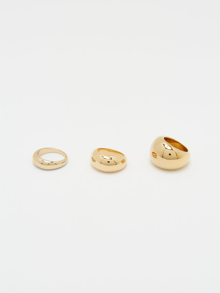 Flat lay of Thin, Small and Large Gold Orb Rings by bagatiba
