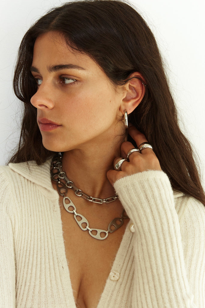 Model wearing multiple styles including the Thin Silver Orb Ring Ring bagatiba
