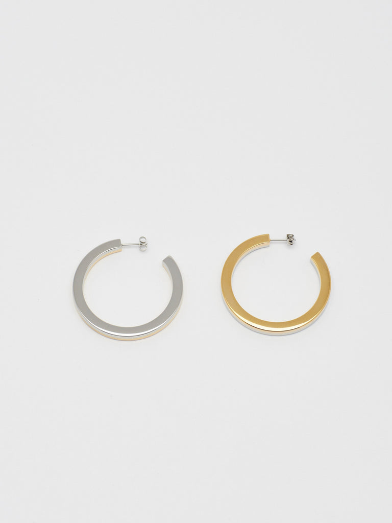 Flat lay of the Two Tone Flat Hollow Hoops Earrings Bagatiba