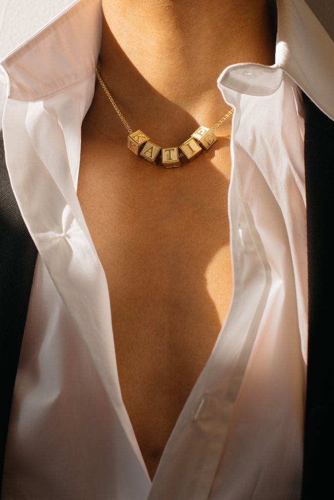 Close up view on model wearing "K" "A" "T" "I" "E"  Letter Block letters Bagatiba