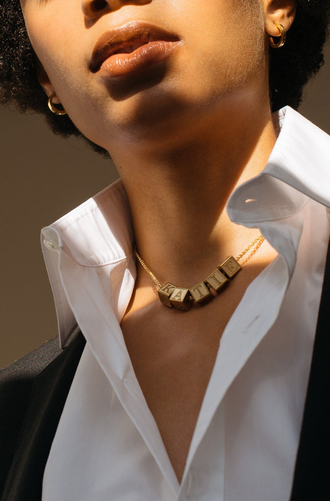 Model wearing 5 Letter Block letters on choker chain Bagatiba
