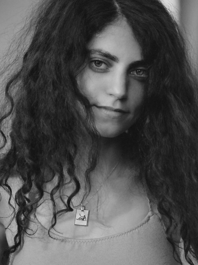 Black and White portrait of a model wearing the Virgo Charm charm Bagatiba