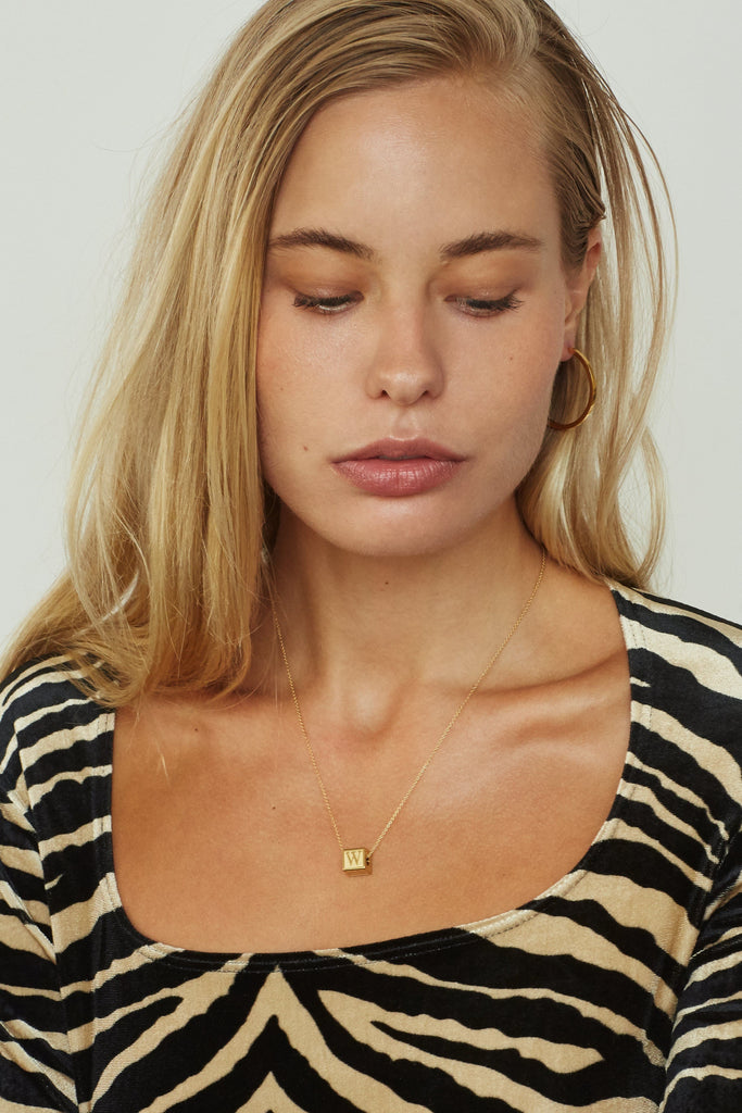 Model wearing "W" Letter Block letters on chain  Bagatiba