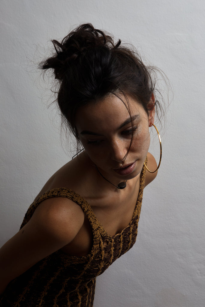 Model wearing the XL Oversized Simple Gold Hoops Earring Bagatiba
