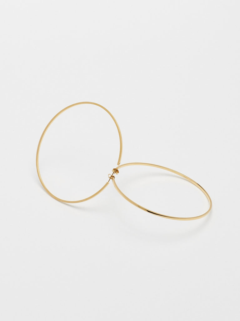 Detail flat lay view of the XL Oversized Simple Gold Hoops Earrings Bagatiba