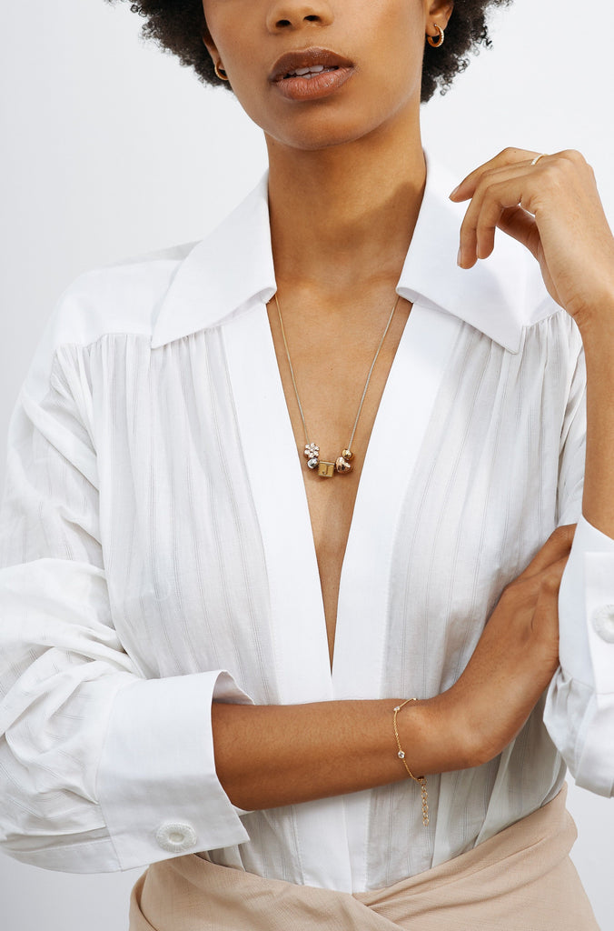 Full view of model wearing "J" Letter Block letters and 4 beads on long chain Bagatiba