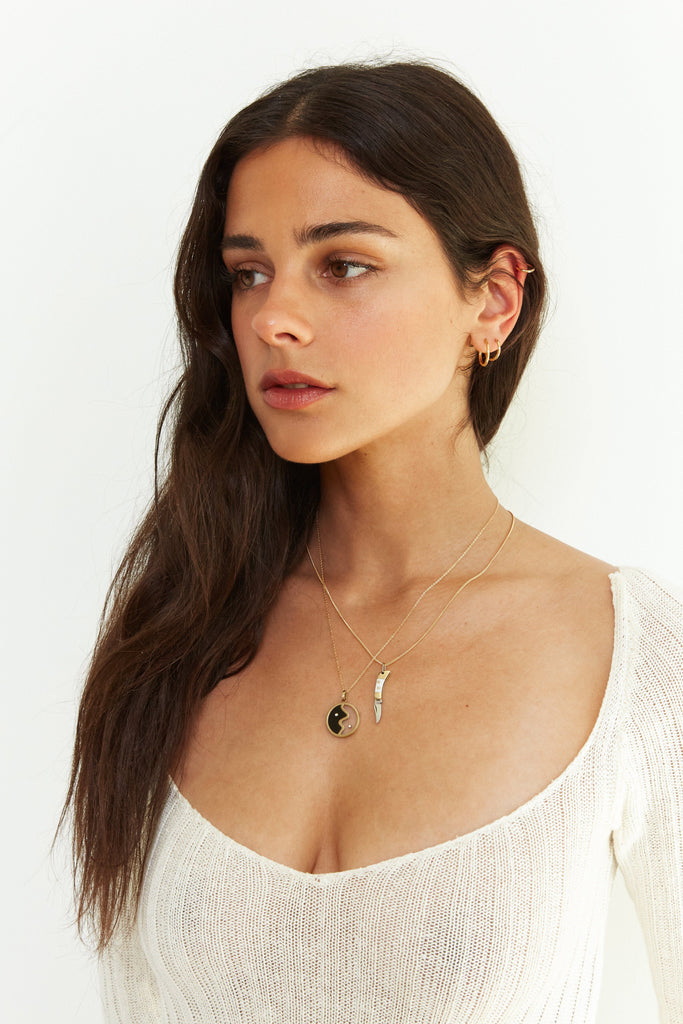 Model profile view wearing the Yin Yang Glass Necklace Necklace bagatiba