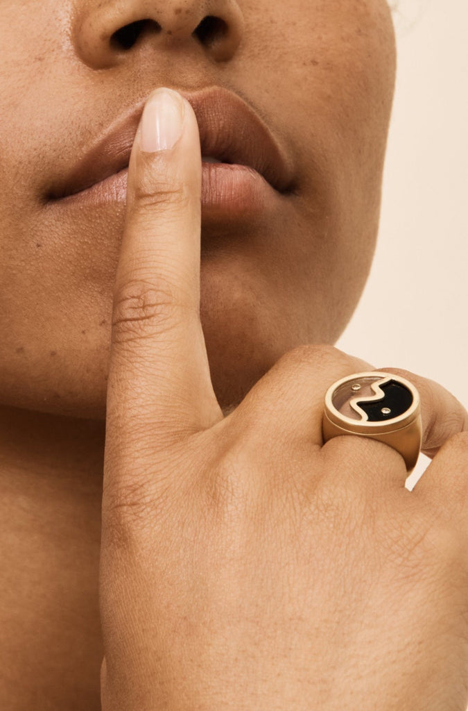 Profile view of model wearing the Yin Yang Glass Ring by bagatiba