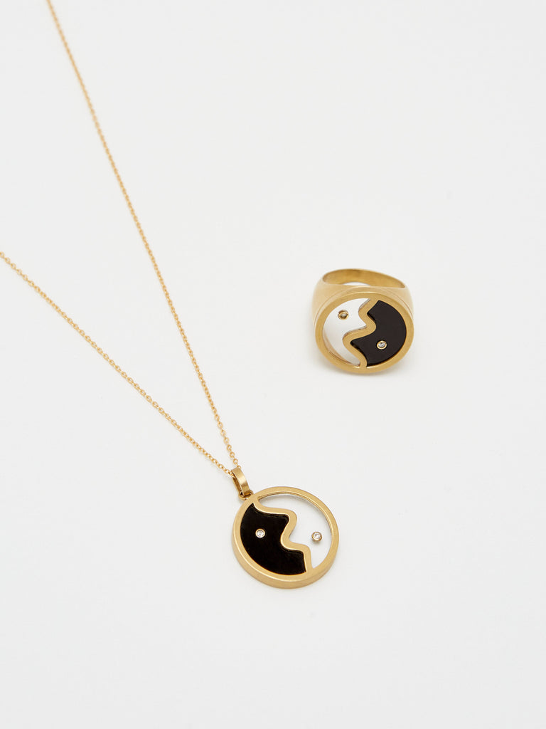 Detail flat lay view of the Yin Yang Glass Ring & Necklace bagatiba