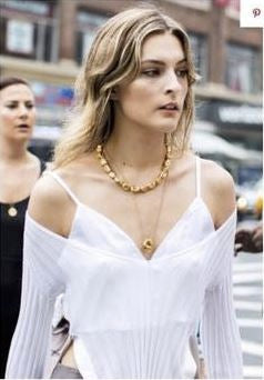 CHRISTIE TYLER IN THE GOLD PEARL & ORB NECKLACES