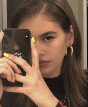KAIA GERBER IN THE GOLD HOLLOW HOOPS
