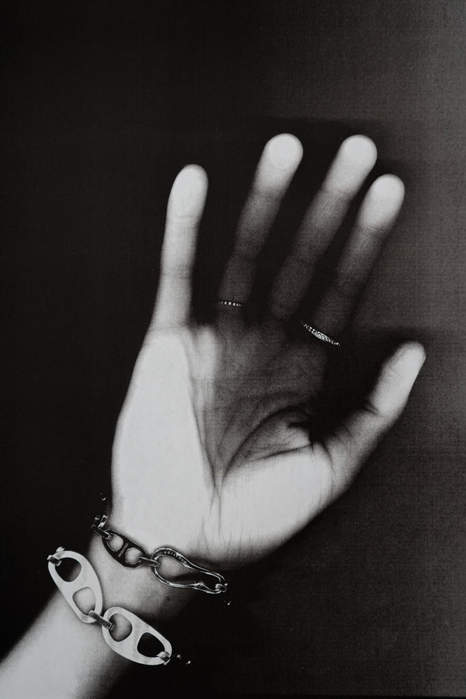 Hand with Tab Bracelets and Rings