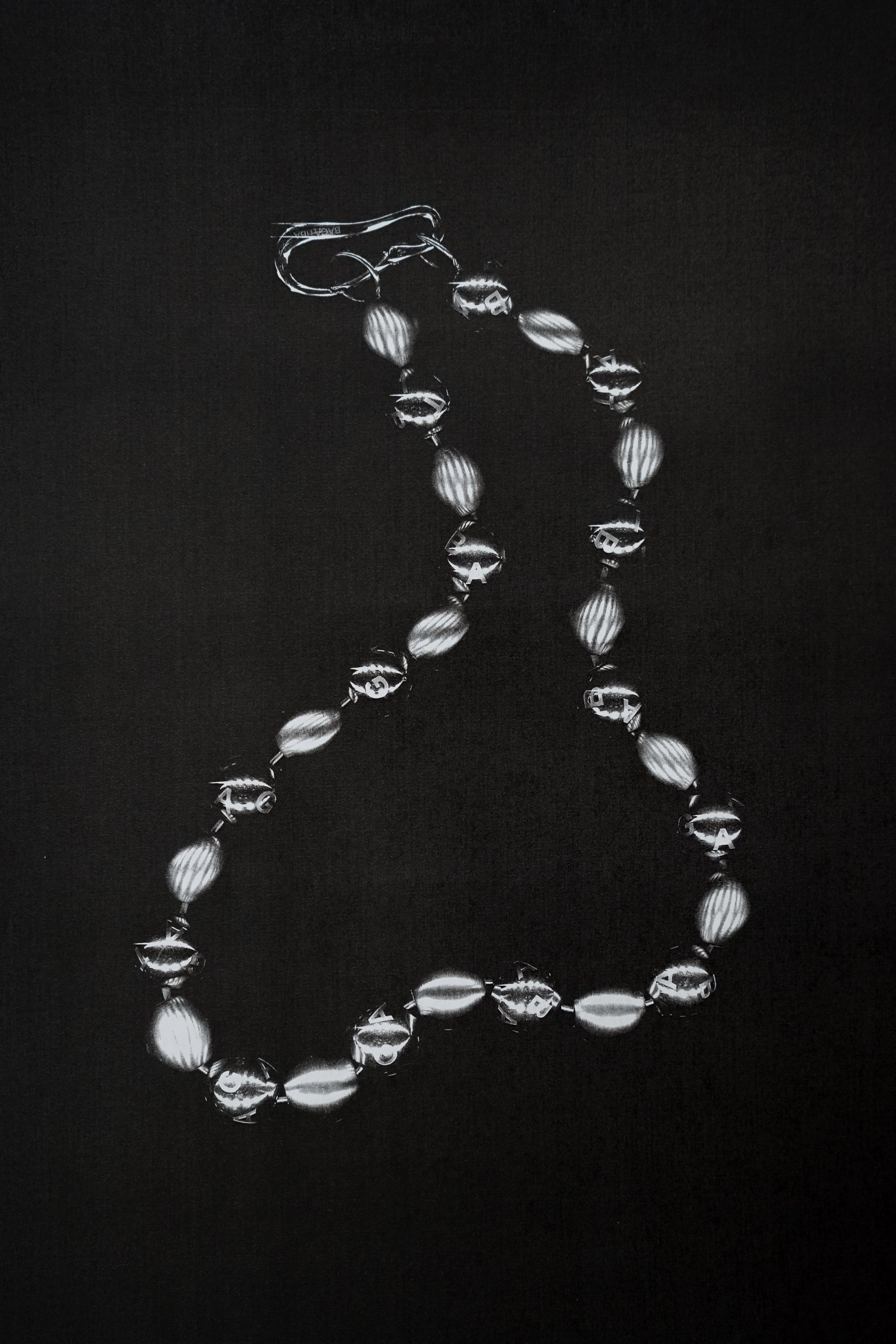 FLAT LAY SHOT OF SPHERE NECKLACE