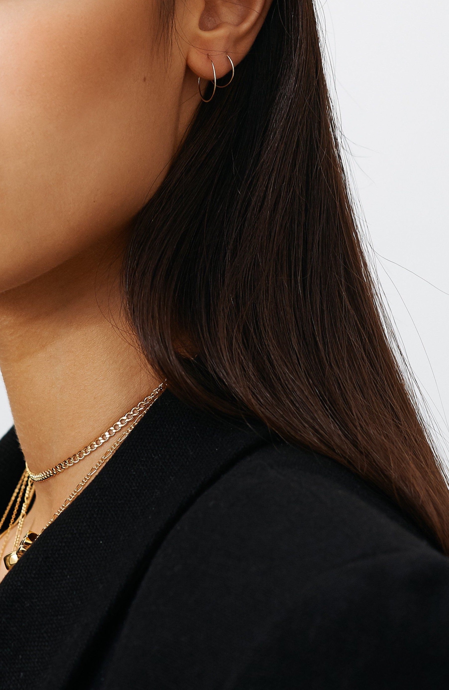 Full view of model wearing 14K 301 Mini Hoops Earrings paired with size 302 & 3 necklaces  Bagatiba 