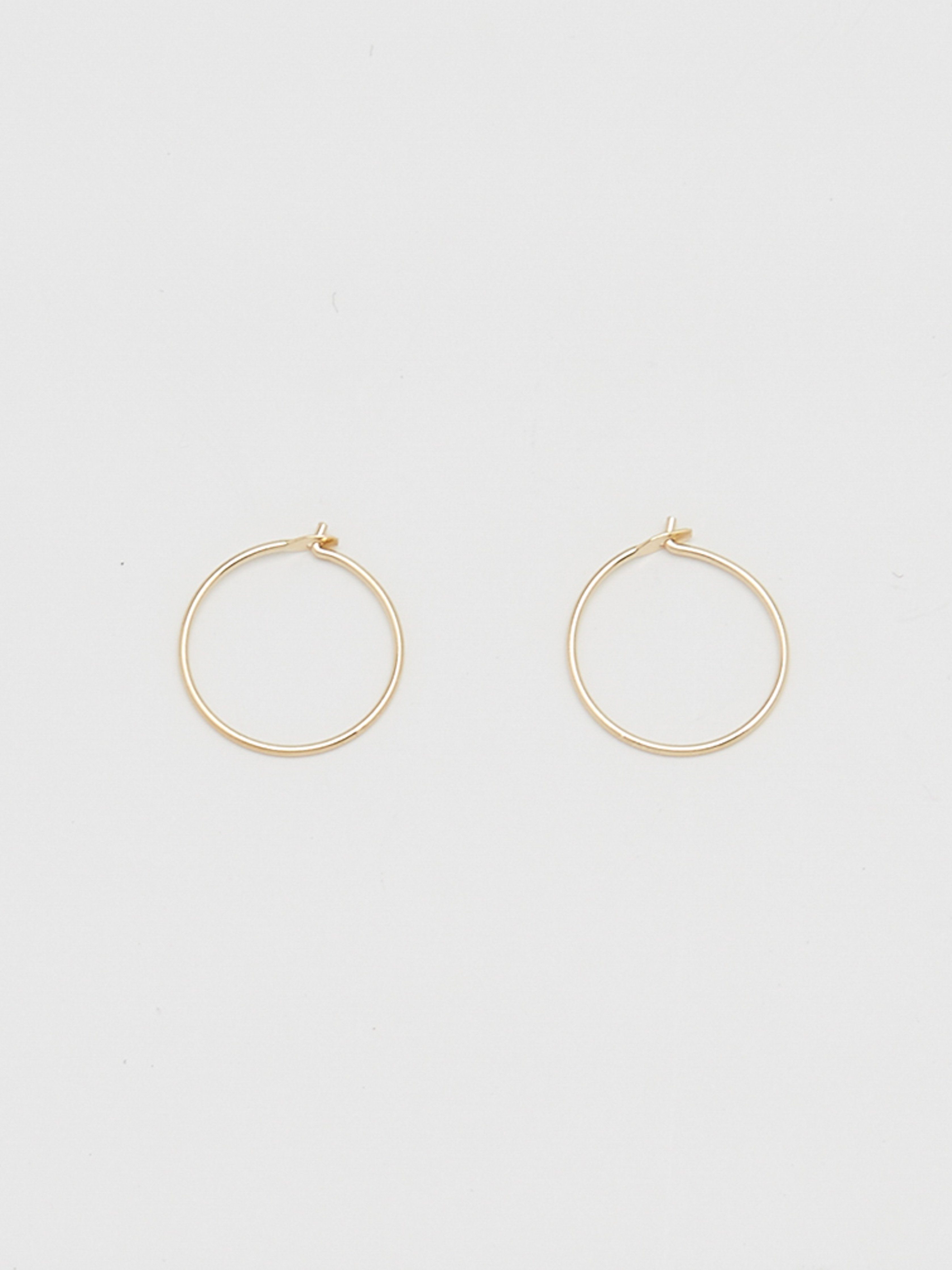 Close up flat lay of 14K 302 Mini Hoops Earrings Bagatiba 