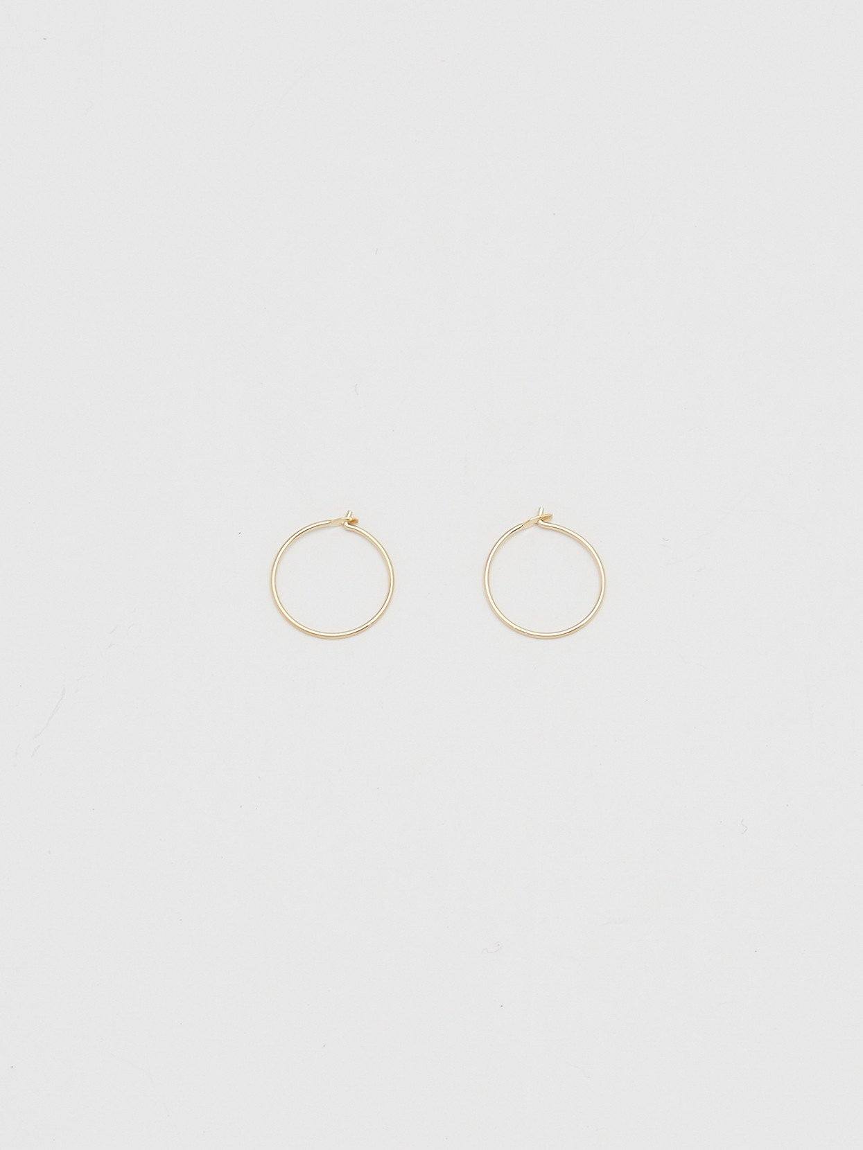 Full view flat lay of 14K 302 Mini Hoops Earrings Bagatiba 